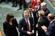 Tony Smith being taken to the Speaker's chair